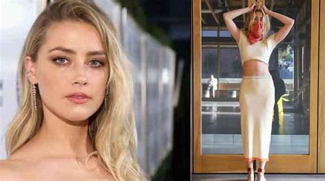 Amber Heard Flaunts Her Trim Figure As She Reveals Her Outfit To Beat