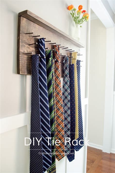 Love the distressed wood with old fashioned square metal nails. Craftaholics Anonymous® | DIY Tie Rack Tutorial