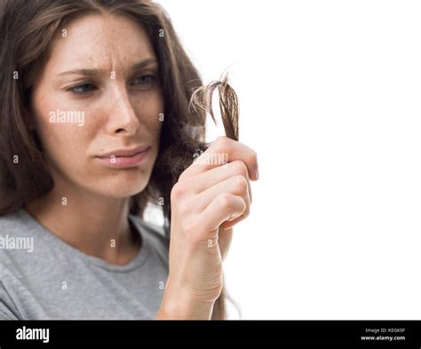 Upset Angry Woman Checking Split Ends On Her Damaged Messy Hair Hair