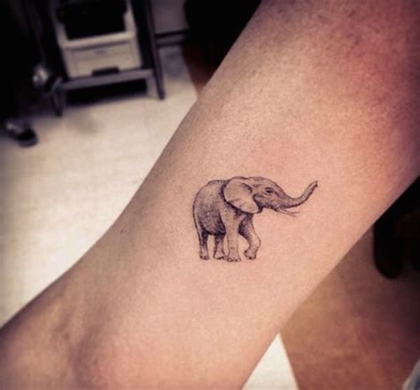 The elephant form is filled with exquisite artistry and the finest details, with its front legs raised and trunk extending to the side of the hand. 16 Beautiful Tribal Elephant Tattoo | Only Tribal