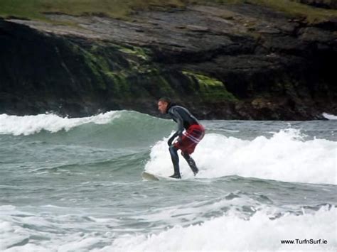 Do surfers wear board shorts under wetsuit?