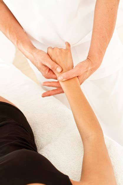 Premium Photo Professional Massages To A Woman On Her Hand And Arm