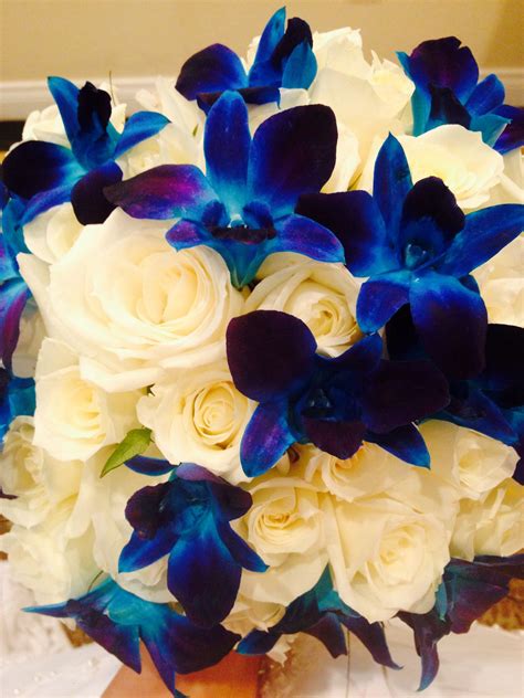 wedding bouquet white roses blue dendrobium orchids