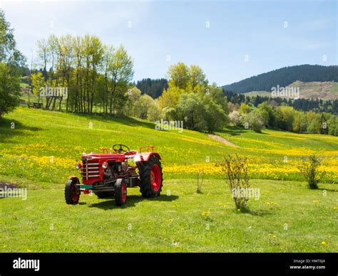 Red Tractor Parked On Green Grass Hi Res Stock Photography And Images
