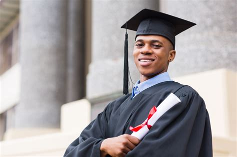 african american male graduate standing outside college - Launch ...