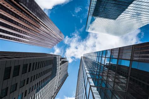 Business And Finance Concept Looking Up At Modern Office Buildings In