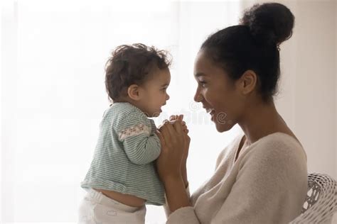 Happy African American Mother And Toddler Girl Enjoying Tender Moment