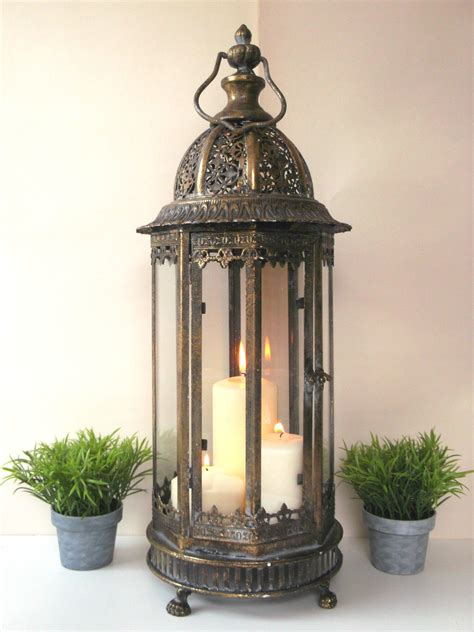 A solar lantern boasts sturdy aluminum construction that holds up well outdoors and will turn on as soon as the sun sets, so you don't have to turn them on. Large Vintage Style 60cm Moroccan Lantern Candle Holder ...