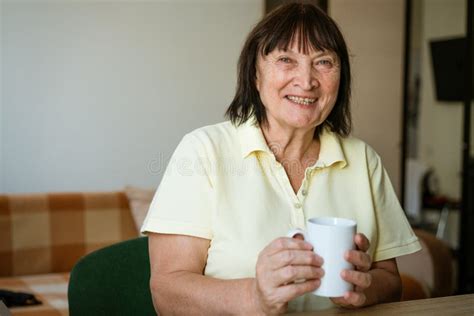 Mature Woman At The Table At Home With A Mug Stock Image Image Of