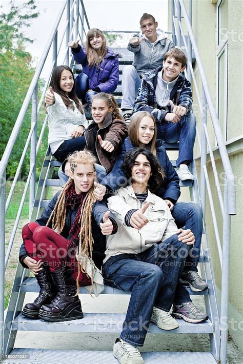 Group Of Teenagers Sitting On Stairs Stock Photo Download Image Now