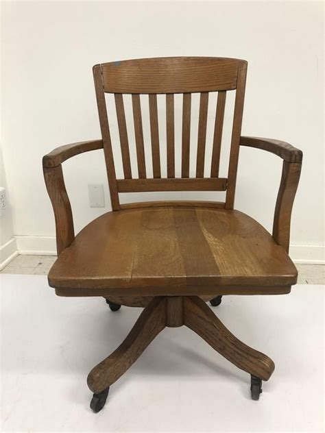 Outfitted with a pressurized seat height adjustment and locking tilt control with customizable tension, this chair is a fully revamped. Vintage WOOD OFFICE CHAIR Swivel arm banker desk ...