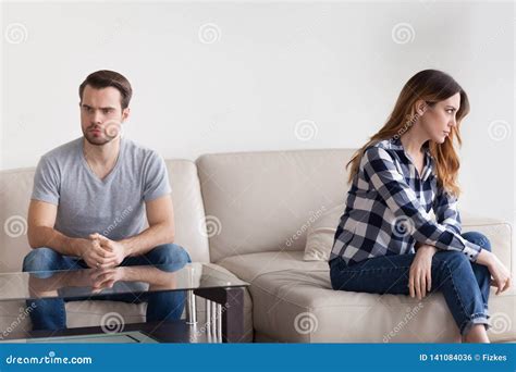 Unhappy Stubborn Married Couple Feel Angry Frustrated Sitting On Couch
