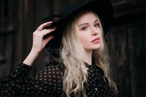Beautiful Attractive And Stylish Girl Wearing Black Hat Standing Posing In City Nude Makeup