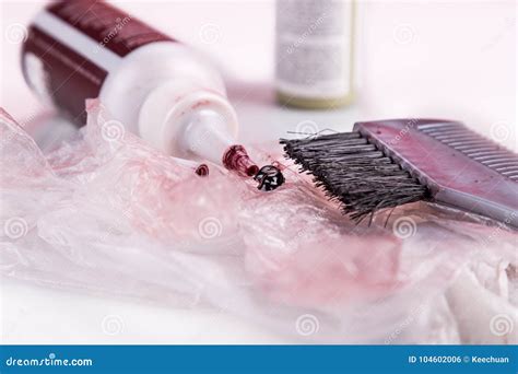 Close Up Of Chemical Hair Color Dye Set With Comb Brush Stock Photo
