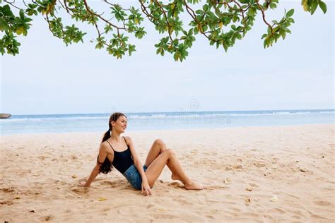 sea woman beach vacation travel sand sitting water smile nature freedom stock image image of