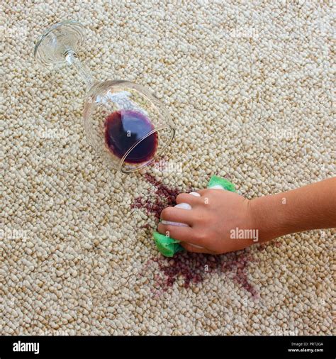 Glass Of Red Wine Fell On Carpet Wine Spilled On Carpet Female Hand