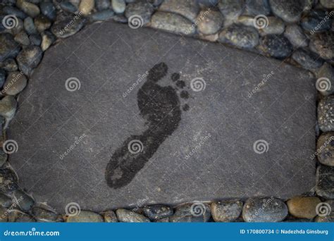 Footprints Of Bare Feet On A Gray Stone Stock Photo Image Of Cloud