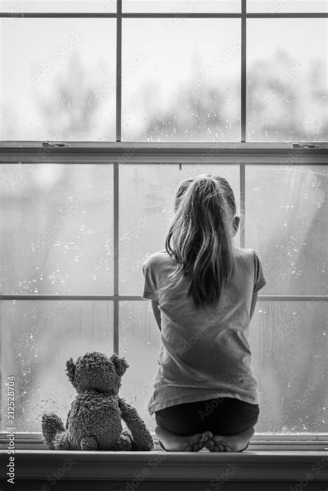 Girl Looking Out Window Stock Photo Adobe Stock