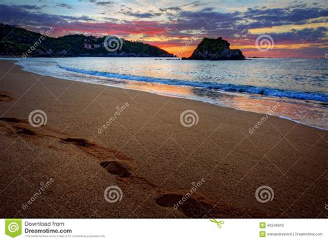 Peaceful Beach Destination Sunrise With Steps On The Sand Stock Photo