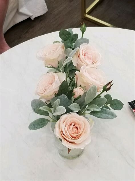 A bouquet composed of white peonies and roses with lamb's ears and seeded eucalyptus. Using garden roses, ranunculus, lambs ear, silver dollar ...