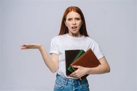 Confused Furious Young Woman College Student Holding Book And Screaming