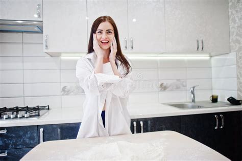 Brunette Girl Wear At Shirt And Underwear Cooking At Kitchen Stock