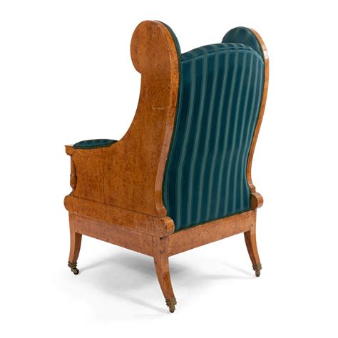 A wingback or high back armchair can create a great reading spot, with a strategically positioned floor. Russian neoclassic silk winged arm chair