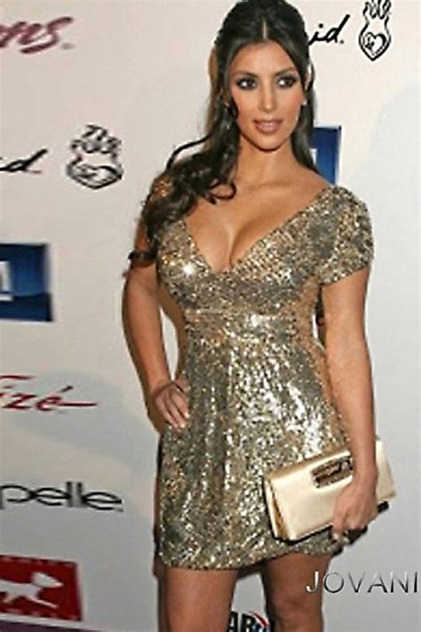 Kim Kardashian Wears A Vintage Gold Jovani Dress With Cap Sleeves