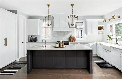 Well Appointed Black And White Kitchen Boasts A Black Center Island