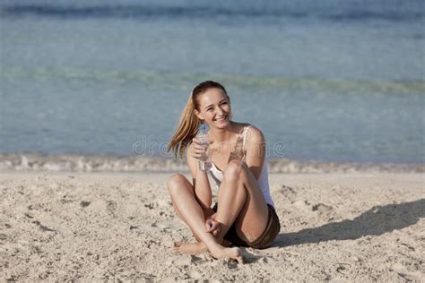 Woman Drinking Water From A Bottle On The Beach Portrait Stock Image Image Of Liquid Drink