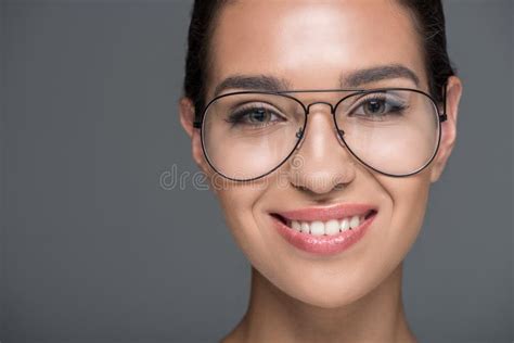 Portrait Of Beautiful Stylish Smiling Woman In Eyeglasses Looking At
