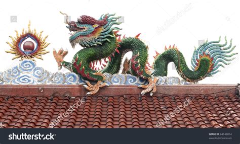 Dragon And Sun Sculpture In Old Chinese Temple Roof Stock Photo