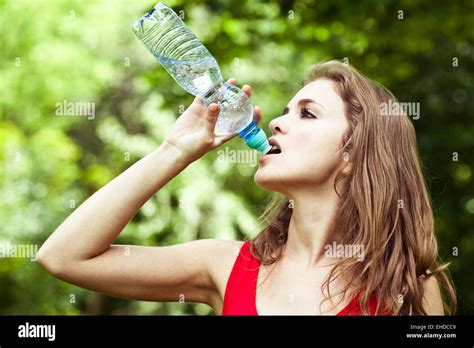 Girl Drink Water In Park After Sport Stock Photo Alamy