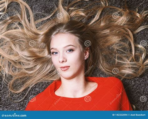Young Woman With Her Long Blond Hair Spread Out Stock Photo Image Of