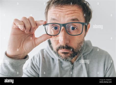 Man Trying Out New Pair Of Eyeglasses Making Funny Face Close Up With