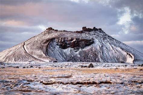 An Old Inactive Volcano Covered In Snow With A Staircase Stock Photo
