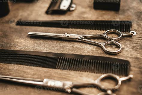 Combs And Scissors For Cutting Hair Lie On A Shelf In A Hairdressing