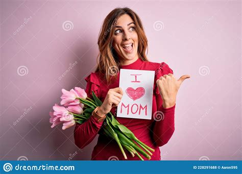 Beautiful Brunette Woman Holding Love Mom Message And Tulips Celebrating Mothers Day Pointing