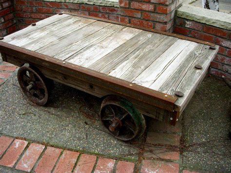 These antique carts come from old furniture and textile factories right here in north carolina! Rail car table. | Community Tables | Pinterest