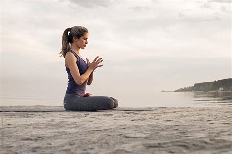 Blonde Woman Practicing Yoga At Waterfront By Stocksy Contributor Danil Nevsky Stocksy