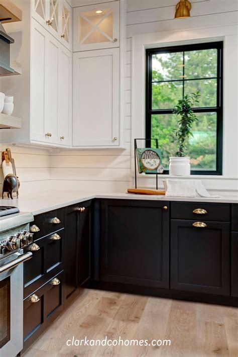 Black Windows And Lower Base Cabinets Accent The Upper White Cabinets