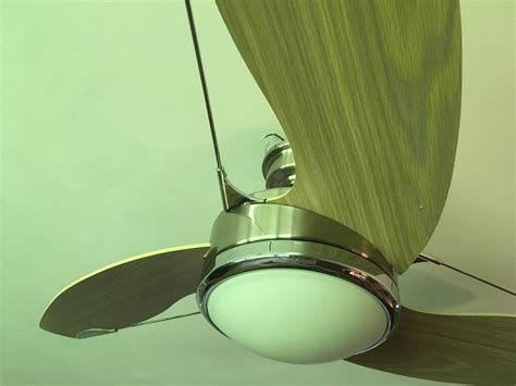 Remove and discard the center plug from the switch housing. How to open this ceiling fan fixture to change the ...
