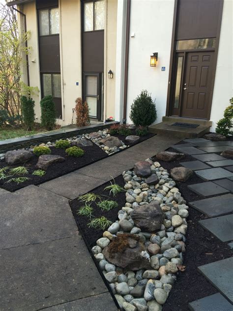 No matter the size, a wel. Townhouse Landscaping with dry river and slate design ...