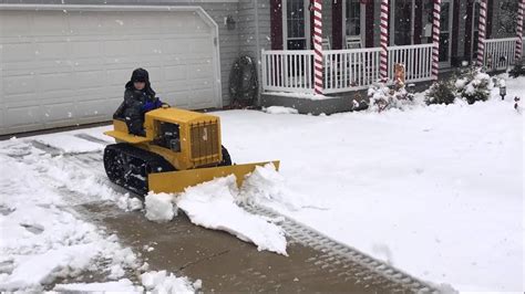 My Son Plowing Snow On His Caterpillar Replica Mini Dozer Youtube