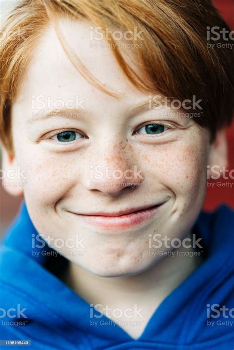 Closeup Portrait Of Smiling Boy With Green Eyes Stock Photo Download
