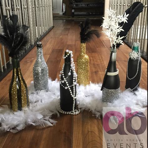 Gatsby theme party decorations are an absolute must for a 1920s art deco theme party. Decorative Bottles : A Great Gatsby theme decor. Sparkles ...