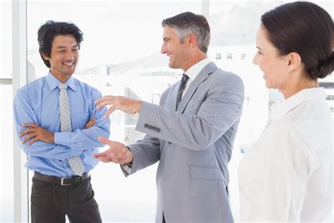 Happy Employees Having A Discussion Stock Photo Image Of