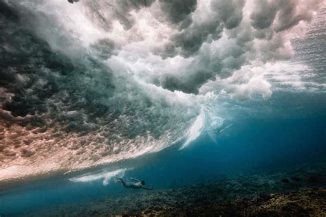 Photographer Captures Stunning Underwater Photos Beneath Breaking Waves