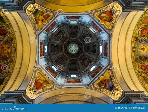Symmetrical Interior Shot Of Masterful Ceiling Of Salzburg Cathedral In