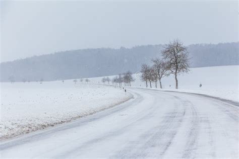 Wonderful Snowy Icy Winter Road With White Snowy Track Stock Photo